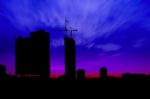 Dark Twilight And Silhouette Construction City With Crane On Top Building Stock Photo