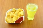 Potato Chip And Beverage On Table Stock Photo