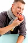 Smiling Young Man Posing With Apple Stock Photo