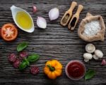 The Ingredients For Homemade Pizza On Shabby Wooden Background Stock Photo