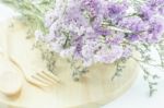 Wooden Set Of Food Utensil And Static Flower Stock Photo