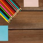 Pencils And Note Papers On A Background Of Dark Wood Tables With Stock Photo