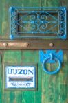 Wooden Door With A Slot Mailbox And The Word In Spanish Means "b Stock Photo