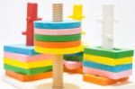 Colorful Puzzle Wooden Toy On White Table Stock Photo