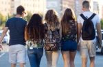 A Group Of Friends Talking In The Street After Class Stock Photo