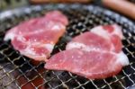 Grilling Pork On Grill Stock Photo