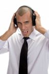 Businessman Holding Headphone Stock Photo