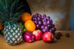 Pineapple And Fruits From On A Wooden Stock Photo