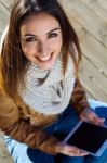 Outdoor Portrait Of Young Woman With Digital Tablet Stock Photo