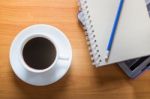 Hot Cup Of Coffee On Working Table Stock Photo