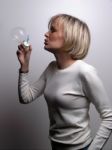 Young Lady Blowing Bubbles Stock Photo