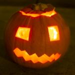 Carved Lit Halloween Pumpkin Stock Photo