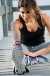 Young Woman Doing Push Ups Near The Sea Stock Photo