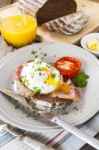 Poached Egg And Bacon On Rye Bread, Healthy Breakfast Stock Photo