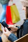 Young Woman Shopping In The City With His Mobile Phone Stock Photo