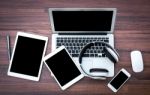 Laptop With Tablet And Smart Phone On Table Stock Photo