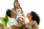 Young Girl Sitting On Shoulders Stock Photo