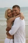 Couple Embracing at beach Stock Photo