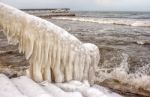 Ice Covered Staircase On The Beach Stock Photo