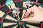 Taking Out Dart From Dartboard Stock Photo