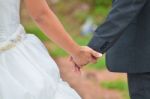 Bride And Groom Walking Away On The Road Stock Photo