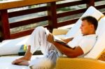 Male Reading A Book Stock Photo