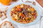 Brown Beans With Meat And Carrot Stock Photo