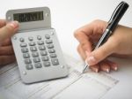 Bookkeeping With Calculator Stock Photo