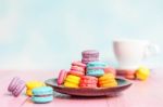 French Macarons On Pink Wooden Background. Vintage Style Stock Photo