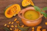 Pumpkin Soup In Clay Pot With Fresh Pumpkins Stock Photo