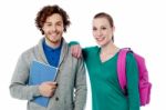 Girl Resting Her Arm On Classmates Shoulder Stock Photo