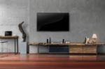 Led Tv On Concrete Wall With Wooden Furniture In Living Room Stock Photo