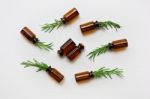 Glass Bottle Of Essential Oil  With Rosemary Stock Photo