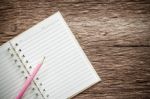 Blank Notebook With Pencil On Old Wooden Table, Business Concept Stock Photo