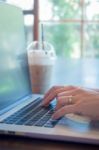 Woman Hands Typing On Laptop Stock Photo