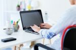 Pretty Young Woman Using Her Laptop In The Office Stock Photo