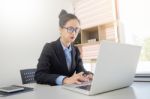 Attractive Women In Casual Business Sitting At A Table Working O Stock Photo