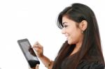 young Woman pressing Tablet PC Stock Photo