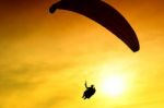 Silhouette Of Parachute On Sunset Stock Photo