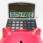 Duty Free Calculator Shows Untaxed Merchandise And Goods Stock Photo