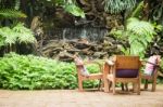 Outdoor Wooden Chair In The Garden Stock Photo