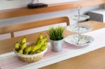 Banana On Wooden Table Stock Photo