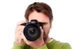 Closeup Portrait Of A Young Man Taking A Picture Stock Photo