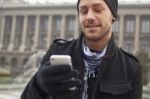 Man With Mobile Phone In Hands Stock Photo