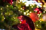 Close Up Big Red Glitter Ball Christmas On Tree With Wire White Light Background Stock Photo