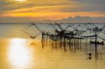 Fisherman And The Sea, Thailand Stock Photo