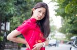 Portrait Of Thai Teen Beautiful Girl In Chinese Dress, Relax And Smile Stock Photo