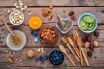 Ingredients For A Healthy Foods Background, Nuts, Honey, Berries Stock Photo