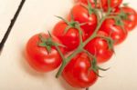 Fresh Cherry Tomatoes On A Cluster Stock Photo