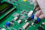 Close-up Of A Male Technician Repairing Electronic Board Stock Photo